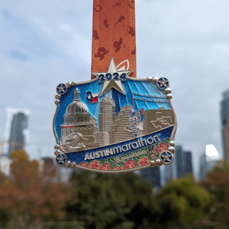 2024 Austin Marathon finisher medal with skyline