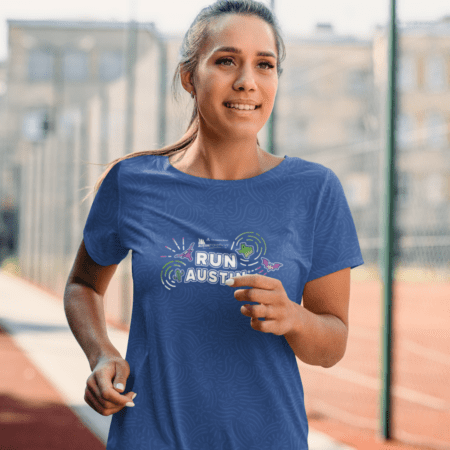 Woman running on track in blue shirt