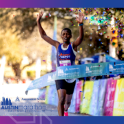 Runner crossing Austin Marathon finish line, confetti