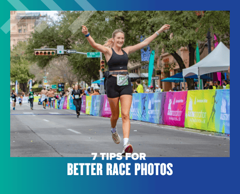 Smiling female runner crossing race finish line