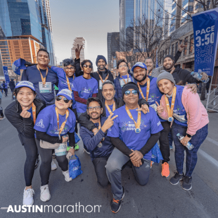 Austin marathon group posing with medals