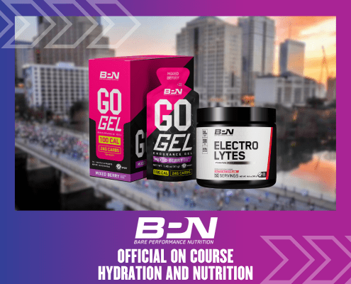 Image of two Bare Performance Nutrition products with a cityscape background. The products, "Go Gel, Mixed Berry" in a pink and black box and "Electrolytes" in a black tub, are showcased. Text below reads: "BPN - Official On-Course Hydration and Nutrition for the Ascension Seton Austin Marathon. Austin Marathon Half Marathon & 5K