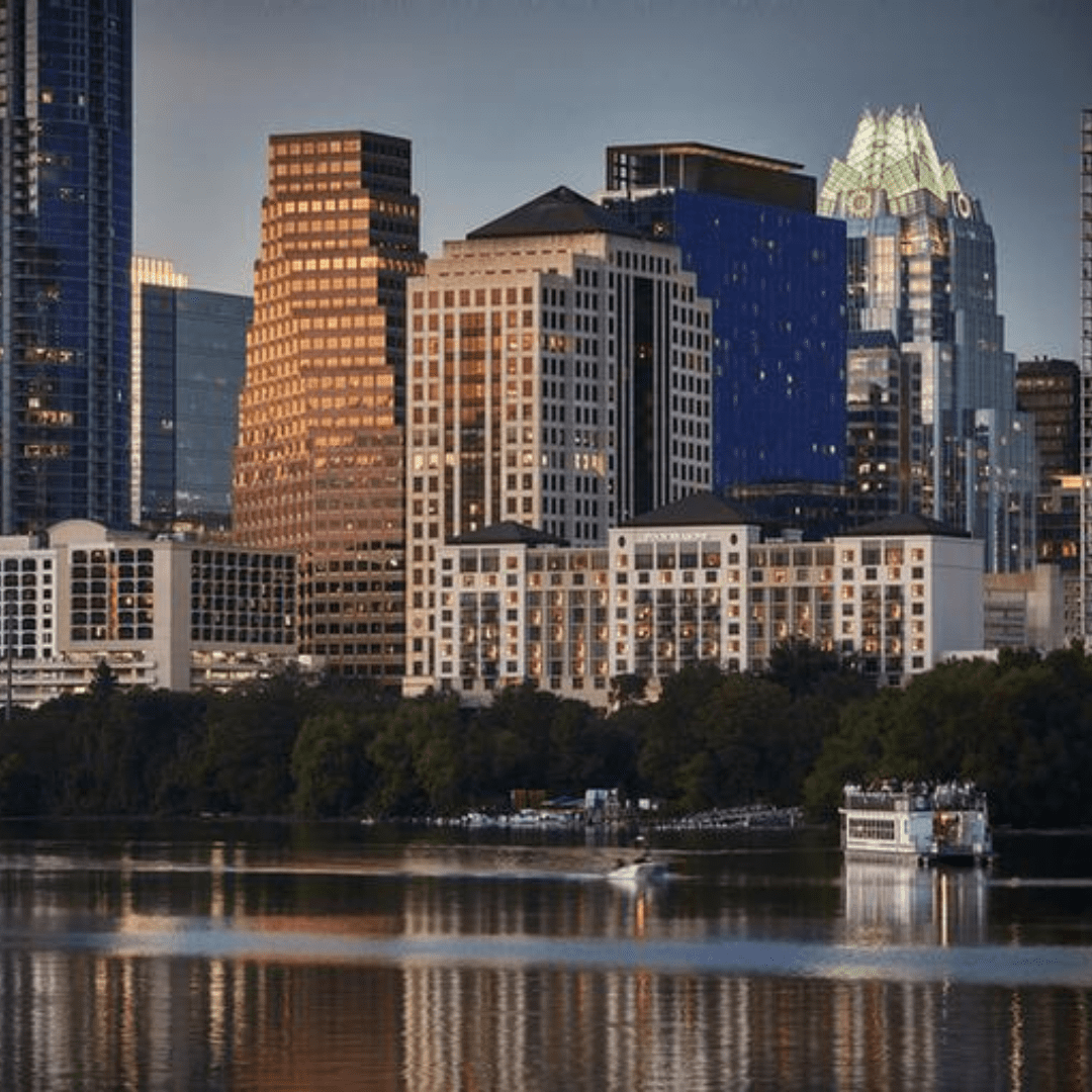 A city skyline at dusk, with tall buildings reflecting sunlight, sets the scene for a picturesque visit. A river runs in the foreground, with a boat cruising on the water. Trees line the riverbank, and the sky is partially cloudy, casting a warm glow over this tranquil moment. Austin Marathon Half Marathon & 5K A city skyline at dusk, with tall buildings reflecting sunlight, sets the scene for a picturesque visit. A river runs in the foreground, with a boat cruising on the water. Trees line the riverbank, and the sky is partially cloudy, casting a warm glow over this tranquil moment. Austin Marathon Half Marathon & 5K