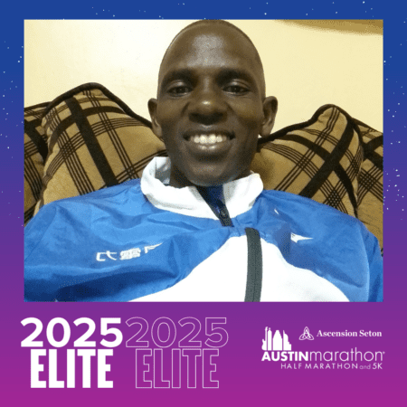 Smiling man in blue jacket with marathon frame Smiling man in blue jacket with marathon frame