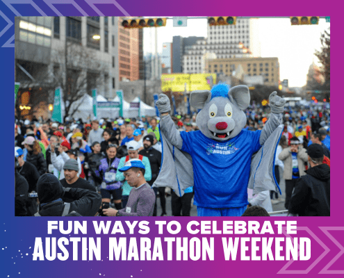 Blue mascot cheering amid Austin Marathon crowd
