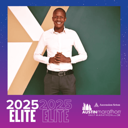 Smiling man by 2025 Elite Austin Marathon banner Smiling man by 2025 Elite Austin Marathon banner