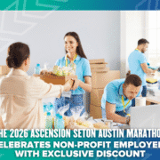 Four people pack food and bottled drinks at a volunteer center. A smiling woman hands a box to another. Text overlay promotes an exclusive Austin Marathon 2026 discount for non-profit employees. Austin Marathon Half Marathon & 5K