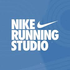 White bold text on a blue background reads "NIKE RUNNING STUDIO" with the Nike swoosh logo above "RUNNING." Subtle circular patterns decorate the background, evoking the spirit of Austin running groups and local marathon training. Austin Marathon Half Marathon & 5K White bold text on a blue background reads "NIKE RUNNING STUDIO" with the Nike swoosh logo above "RUNNING." Subtle circular patterns decorate the background, evoking the spirit of Austin running groups and local marathon training. Austin Marathon Half Marathon & 5K