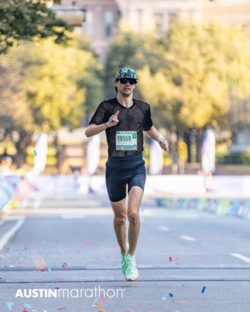 A runner sporting a black outfit and green shoes nears the Austin Marathon finish line, surrounded by colorful confetti and trees—the perfect moment for personal, official race photos. Austin Marathon Half Marathon & 5K A runner sporting a black outfit and green shoes nears the Austin Marathon finish line, surrounded by colorful confetti and trees—the perfect moment for personal, official race photos. Austin Marathon Half Marathon & 5K