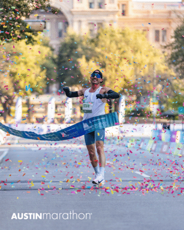 A runner celebrates as he crosses the finish line at the Austin Marathon race, surrounded by colorful confetti and sunlight, with "AUSTIN marathon" text and an Official Race Photos watermark at the bottom of the image. Austin Marathon Half Marathon & 5K A runner celebrates as he crosses the finish line at the Austin Marathon race, surrounded by colorful confetti and sunlight, with "AUSTIN marathon" text and an Official Race Photos watermark at the bottom of the image. Austin Marathon Half Marathon & 5K