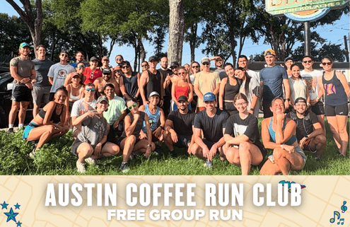 A large group of smiling people in athletic wear poses outdoors on grass under the sunlight. The Austin Coffee Run Club banner reads "Free Group Run." Trees and a sign complete the energetic Austin scene in the background. Austin Marathon Half Marathon & 5K