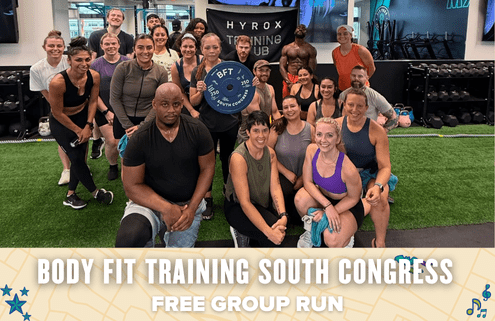 A diverse group of people in workout clothes pose and smile together inside a gym, holding a Body Fit Training sign. The text overlay reads: "Body Fit Training South Congress free group run. Austin Marathon Half Marathon & 5K