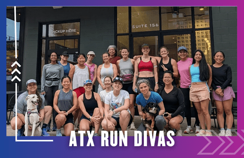 A group of women runners, some holding dogs, pose and smile outside a storefront with large windows after an ATX Run Divas group run. Text at the bottom reads "ATX RUN DIVAS" on a purple and blue gradient background. Austin Marathon Half Marathon & 5K