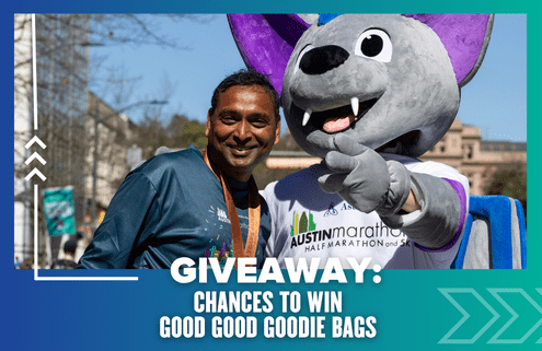 A smiling man wearing a medal stands next to a person in a large purple bat mascot costume at an outdoor event. Text reads: "GIVEAWAY: CHANCES TO WIN GOOD GOOD GOODIE BAGS." Perfect template for your next exciting giveaway!. Austin Marathon Half Marathon & 5K