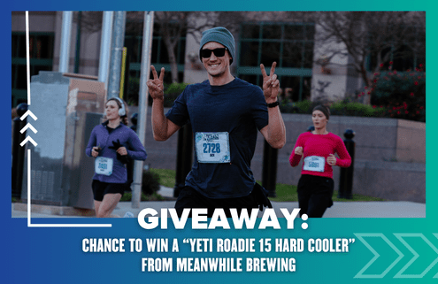 A smiling runner in sunglasses and a beanie flashes peace signs during a race, with others in the background. Enter the Giveaway below for your chance to win a Yeti Roadie 15 Hard Cooler from Meanwhile Brewing!. Austin Marathon Half Marathon & 5K