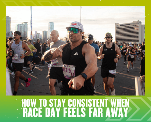 A group of runners participates in a race on a city street, with sunlight and tall buildings in the background. Text at the bottom reads, "How to stay consistent with training when race day feels far away. Austin Marathon Half Marathon & 5K