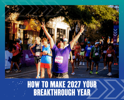 Marathon runner celebrating with arms raised