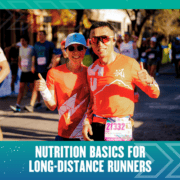 Two runners in red shirts giving thumbs-up