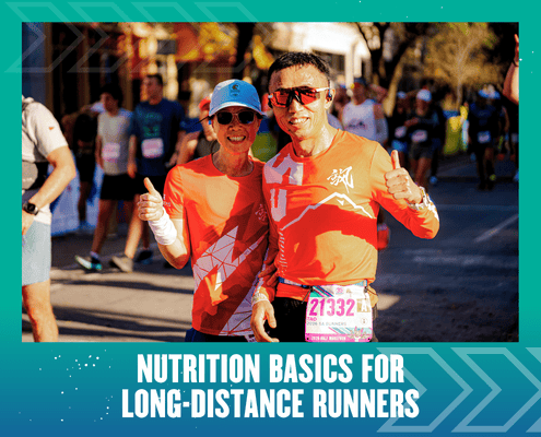 Two runners in red shirts giving thumbs-up