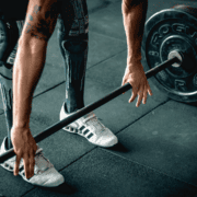 Athlete preparing to deadlift with barbell