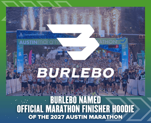 A large crowd of runners gathers at the Austin Marathon start line, with the BURLEBO logo proudly displayed alongside text announcing BURLEBO as the official Marathon Finisher Hoodie for the 2027 Austin Marathon. Austin Marathon Half Marathon & 5K