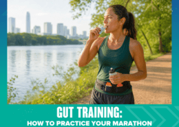 A woman in athletic gear eats an energy gel while running on a riverside trail with a city skyline in the background. Text reads: “Gut Training: How to Practice Your Marathon Fueling Plan in September.” This scene highlights the importance of marathon fueling and gut training as essential parts of marathon training. Austin Marathon Half Marathon & 5K