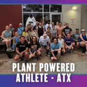 A group of people poses together on and around picnic benches outside a building, celebrating KickOff Week. The text at the bottom reads, āPlant Powered Athlete - ATX.ā The border is purple and blue with small bat icons. Austin Marathon Half Marathon & 5K