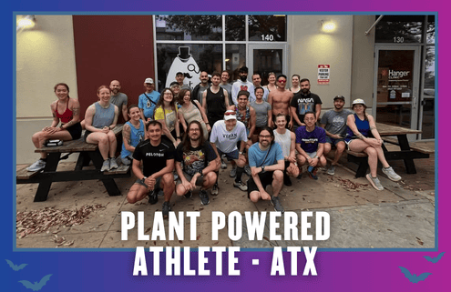 A group of people poses together on and around picnic benches outside a building, celebrating KickOff Week. The text at the bottom reads, “Plant Powered Athlete - ATX.” The border is purple and blue with small bat icons. Austin Marathon Half Marathon & 5K