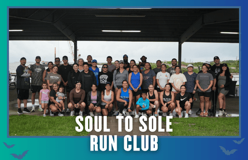 A large group of people—men, women, and children—pose in workout clothes under a pavilion, celebrating KickOff Week. The text “Soul to Sole Run Club” appears at the bottom of the image with a blue gradient border and small bat graphics, capturing the excitement of this Group Run event. Austin Marathon Half Marathon & 5K