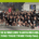 A large group of runners poses together on a city street at night, all wearing matching “Team SpiBelt” shirts. Text below reads: “The Ultimate Guide to Austin running groups: Find Your Tribe This Fall.”. Austin Marathon Half Marathon & 5K