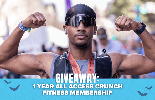 A person wearing sunglasses and flexing their arms stands outdoors. Text reads: “GIVEAWAY: 1 YEAR ALL ACCESS CRUNCH FITNESS MEMBERSHIP.” Blue accents and bat illustrations appear at the bottom, highlighting your chance to win a Spibelt in this exciting giveaway. Austin Marathon Half Marathon & 5K
