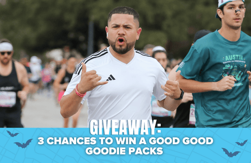A man running in a race with others, making a shaka hand gesture. Text below reads: “GIVEAWAY: 3 CHANCES TO WIN A GOOD GOOD GOODIE PACKS and an LSKD Running Kit,” with a blue background and bat graphics. Austin Marathon Half Marathon & 5K