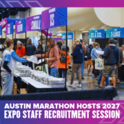 People browse rows of tables with hanging size signs at an Austin Marathon expo, an information session for runners before they reach the finish lines. Austin Marathon Half Marathon & 5K